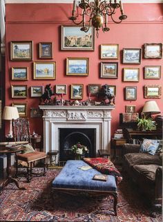 a living room filled with furniture and pictures on the wall above a fire place in front of a fireplace