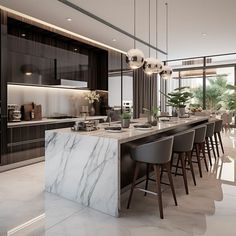 a large kitchen with marble counter tops and bar stools next to the dining room