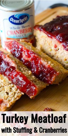 turkey meatloaf with stuffing and cranberries on a cutting board next to a can of gravy