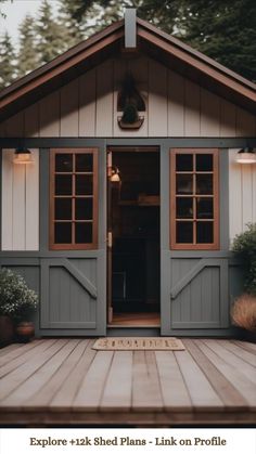 an outdoor shed with the door open and lights on