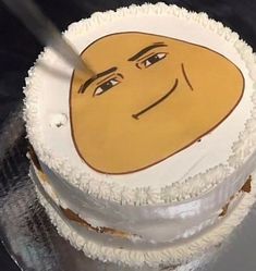 a cake with a face drawn on it