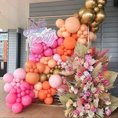 there are balloons and flowers on the table