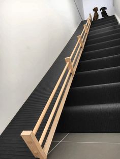 two dogs are sitting on the stairs next to each other