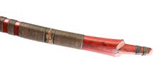 an old red and brown pipe on a white background