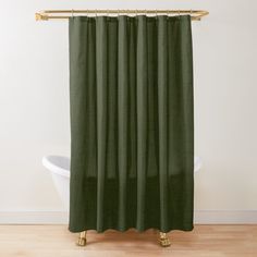 a green shower curtain with an intricate design