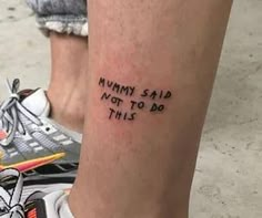 a person with a tattoo on their leg that says, mommy said not to do this