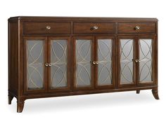 a wooden sideboard with glass doors and gold trimmings on the front, against a white background