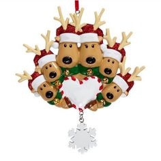 a christmas ornament with five reindeers hanging from it's sides and a heart in the middle