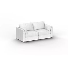 a white couch sitting on top of a white floor