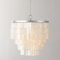 Rectangular shell tiles hanging in tiers offer an updated take on classic vakker. Our pendant showcases the shells to stunning effect, casting an ambient, pearlescent glow. 
 The light-catching iridescence of our exclusive Capiz Chandelier will draw attention even when the lights are off. 3 tiers of more than Capiz shells cascade from an iron frame, emitting a warm glow of diffused light. 
 If you have any questions about our products, please contact us and we will get back to you within 24 hour Capiz Chandelier, Shell Tiles, Shell Chandelier, Rh Teen, Capiz Shell, Hanging Chandelier, Art Deco Lighting, Estilo Art Deco, Vintage Chandelier