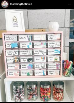 a shelf filled with lots of different types of crafting supplies on top of it