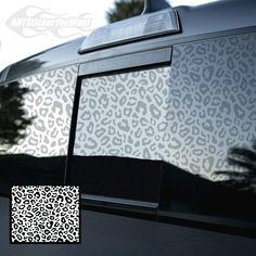 an animal print window sticker on the side of a car with a black and white pattern