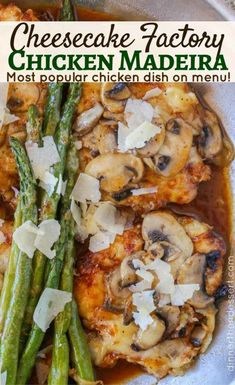 chicken with mushrooms and asparagus on a white plate