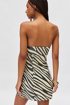 We’re wild for this Silence + Noise mini dress in a slim, bodycon silhouette. Designed in a statement sequined zebra print featuring a strapless tube neckline and tailored seams down the bust & bodice. Find it only at Urban Outfitters. Features Silence + Noise Jessie zebra print strapless mini dress Animal print mini dress Zebra print sequined fabric Strapless tube neckline Tailored seams down bust and bodice Slim body-skimming fit Mini length Zip closure UO exclusive Content + Care 100% Polyest Chic Strapless Sequin Bodycon Dress, Summer Zebra Print Mini Dress For Party, Summer Party Mini Dress With Zebra Print, Spring Zebra Print Mini Dress For Night Out, Fitted Zebra Print Mini Dress For Party, Fitted Zebra Print Mini Dress For Night Out, Spring Party Dress With Zebra Print, Zebra Print Mini Dress For Night Out, Sleeveless Zebra Print Dress For Night Out