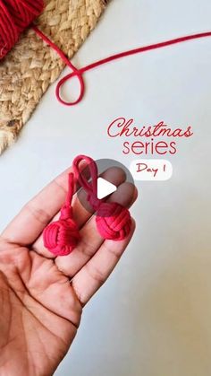 someone is holding yarn in their hand with the words christmas series day 1 written on it