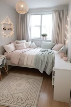 a small bedroom with a bed, desk and chair in it's center area