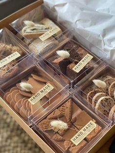 a box filled with lots of different types of cookies and pastries on top of a table