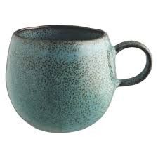 a blue cup with brown speckles on it