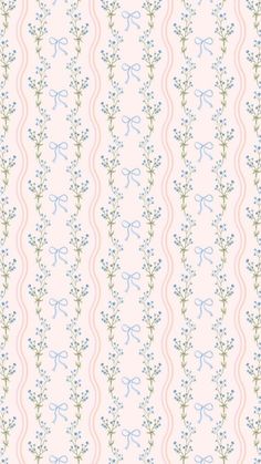 a pink and blue wallpaper with small flowers on the bottom half of it,