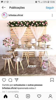 the table is set up with flowers on it