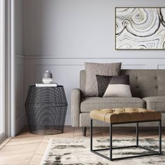 a living room scene with focus on the couch and coffee table in the foreground