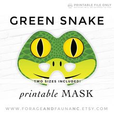 a green snake mask with yellow eyes on it's face and the words printable mask