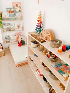 a child's room with toys and books on shelves