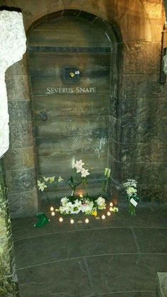 flowers and candles are placed in front of the entrance to severus snape