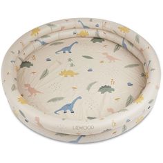 a baby bed with dinosaurs on it