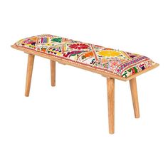 a bench made out of wood with colorful designs on the top and bottom, sitting in front of a white background