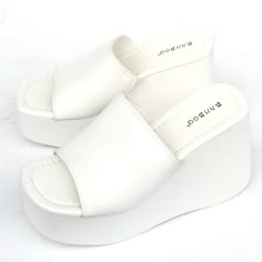 Step Out In These Newly Arrived, Stylish Platform Sandals New In Box Vegan Leatherette Material Wide Band Upper Lightly Padded Insole Comfy Platform Wedge Heels Fitting: True To Size. Regular Foot Width. Cheap Elegant Platform Wedge Sandals, White Wedge Heel Platform Slippers For Vacation, White Platform Slippers With Wedge Heel For Vacation, White Synthetic Wedge Heel Platform Slippers, White High Heel Platform Slippers For Vacation, Trendy White Synthetic Platform Slippers, Chic White Synthetic Platform Slippers, White Platform Slippers With Removable Insole, White Synthetic Platform Slippers For Vacation