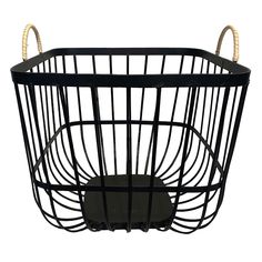 a black metal basket with handles on the top and bottom, holding an object in it