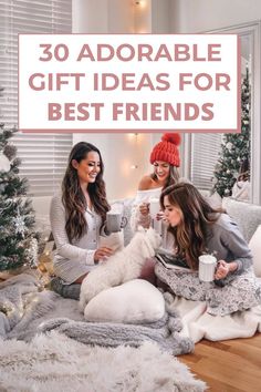 three women are sitting on the floor with their dog and holding coffee cups in front of them