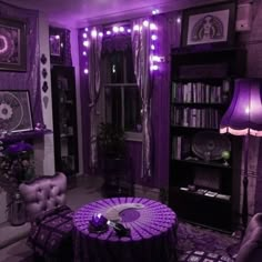 a living room filled with furniture and purple lighting