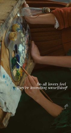 a woman is painting on an easel with a quote from the book do all lovers need they're inviting someone?