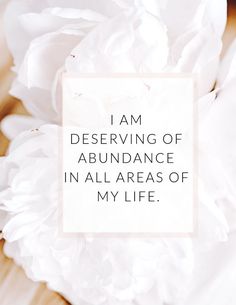 a white flower with the words i am observing of abundance in all areas of my life