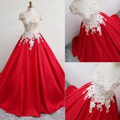 red and white wedding dress on mannequins, with lace appliques