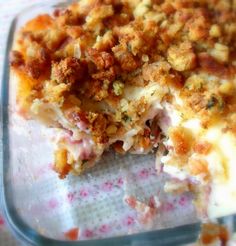 a casserole dish with meat and cheese on it's side, ready to be eaten