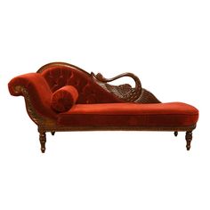 an old fashioned red chaise lounge with wicker back