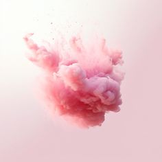 a pink substance is flying in the air