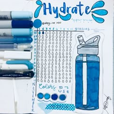 some markers and pens are sitting on top of a paper with the words hydrate