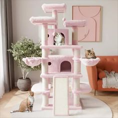 a pink cat tree with two cats sitting on it's top and one in the background