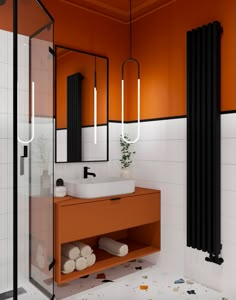 a bathroom with orange walls and white tiles on the floor, along with a black radiator