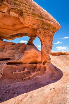 a large rock formation sitting in the middle of a desert