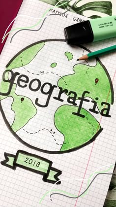 a notebook with the word geografia written on it and a pencil next to it