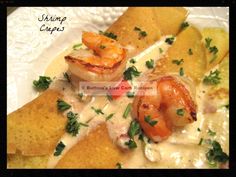 shrimp and cheese crepes on a white plate