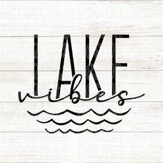 the word lake is written in black ink on a white wood plank background with waves