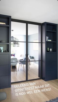 the interior of a modern home with glass doors