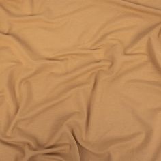 a close up view of a tan colored fabric