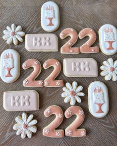 decorated cookies with numbers and flowers on a table